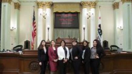 Assemblymember Aguiar-Curry on the Assembly Floor with her UC Davis district office interns
