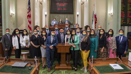 Asm. Aguiar-Curry joins other Assemblymembers in wearing pride masks to celebrate LGBTQ+ rights