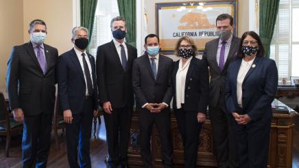 Asm. Aguiar-Curry poses with Gov. Newsom and other California leaders