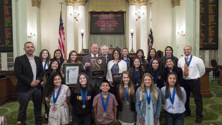 Asm. Aguiar-Curry is joined by Sen. Dodd and Sen. Nielsen in posing with 2018 NorCal Soccer Champs Woodland High School