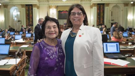 Asm. Aguiar-Curry poses with Dolores Huerta on the Assembly Floor