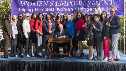 Asm. Aguiar-Curry posing with the California Legislature Women's Caucus during Gov. Jerry Brown signing bills of importance for women's empowerment