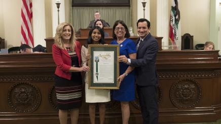 Assemblymember Aguiar-Curry and Speaker Rendon Present Assembly Resolutions to Assembly Fellows Puja Navaney on the Assembly Floor