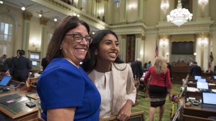 Assemblymember Aguiar-Curry and Assembly Fellow Puja Navaney on the Assembly Floor