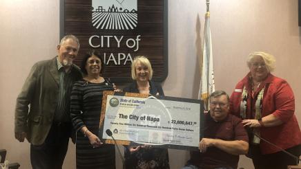 Assemblymember Aguiar-Curry presents check for $22,600,647 to Napa City Council - Scott Sedgley, Mayor Jill Techel, Jim Krider, and Doris Gentry