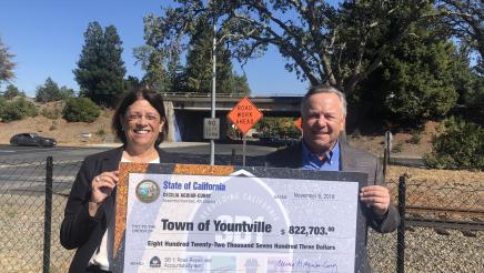 Assemblymember Aguiar-Curry presents check for $822,703 to Mayor John Dunbar of Yountville