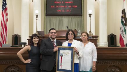 Asm. Aguiar-Curry with 2017 Veteran of the Year Bernie A. Narvaez and his family